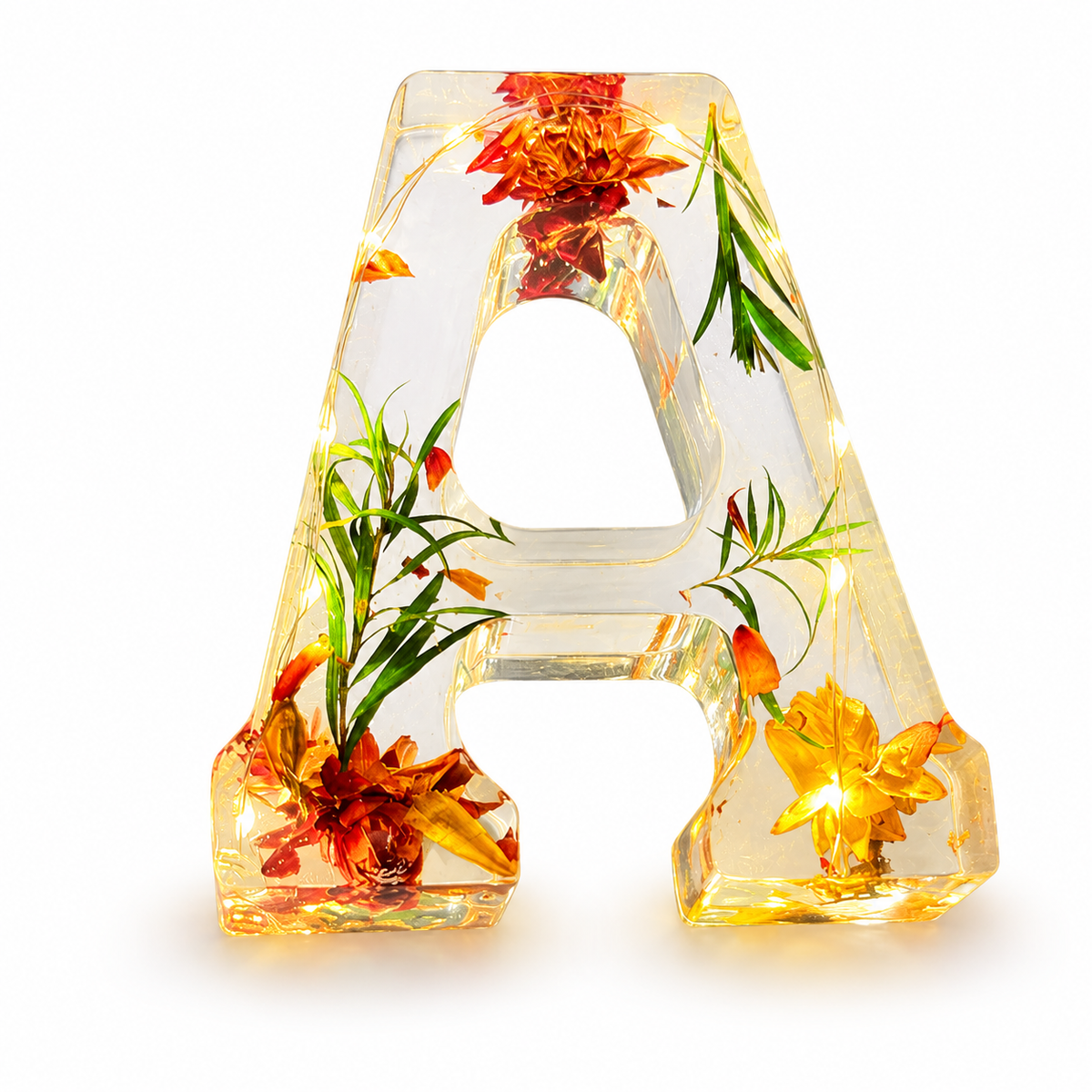 Lámpara de resina con letra y flores secas